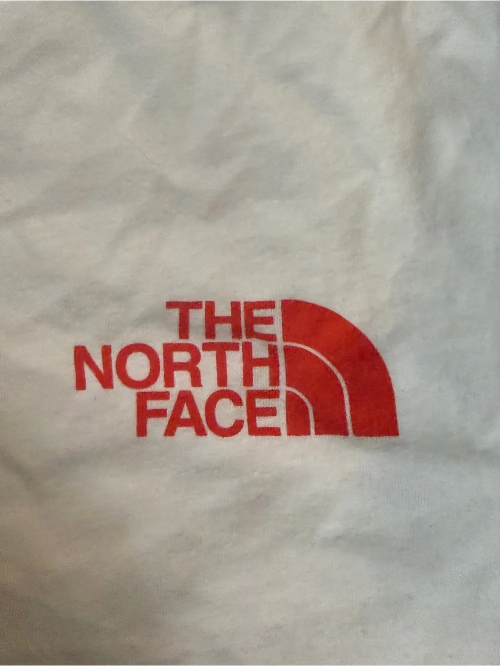 The North Face White Short Sleeve Tee with Red Logo. Size Large